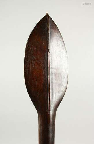 A CARVED WOOD PADDLE CLUB, possibly Pacific Island,