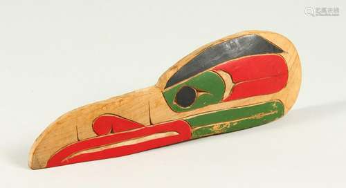 A RED INDIAN BIRD HEAD CARVING, by Harold Patrick.