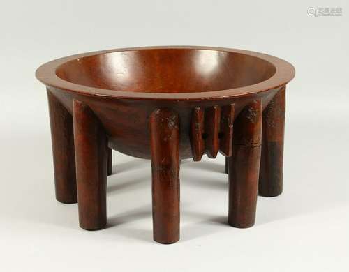 A FIJIAN KAVA BOWL, on eight legs.  40cms diameter x