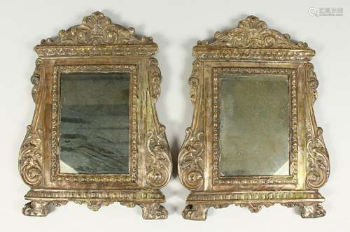 A PAIR OF ITALIAN METAL UPRIGHT MIRRORS, with scroll