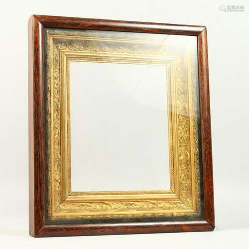 A 19TH CENTURY ROSEWOOD AND GILT GESSO PICTURE FRAME.