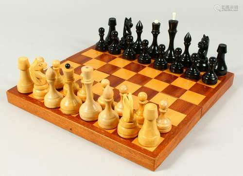 A RUSSIAN TURNED WOOD CHESS SET in a box.