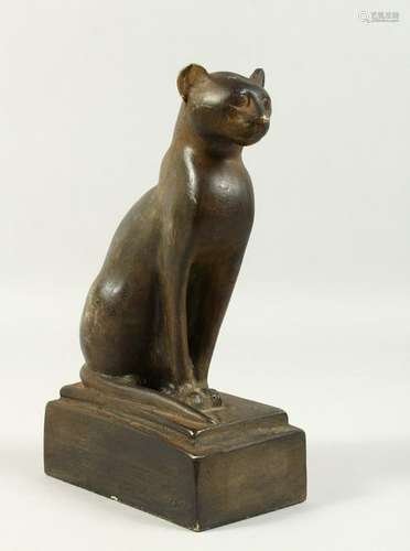 AN EGYPTIAN STYLE PLASTER MODEL OF A SEATED CAT.  20cms