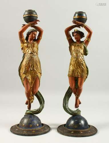 A PAIR OF CAST METAL, PAINTED CANDLESTICKS, modelled as