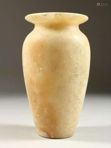 AN ALABASTER URN. possibly Egyptian.  20cms high.