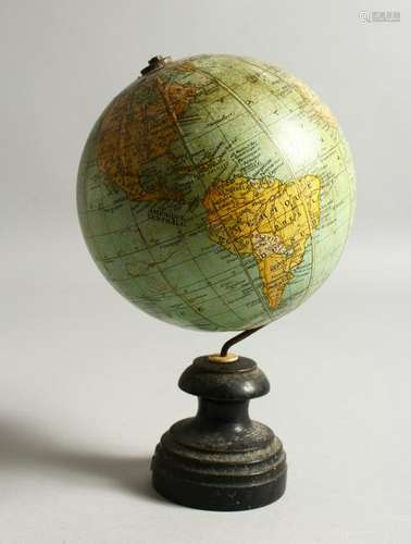 A SMALL TERRESTRIAL GLOBE, on turned wood stand.  20cms