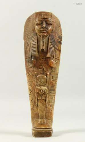 AN EGYPTIAN CARVED STONE USHABTI.  27cms high.