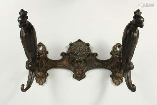 A CAST IRON COAT STAND by PAUL KOCH, with two birds.