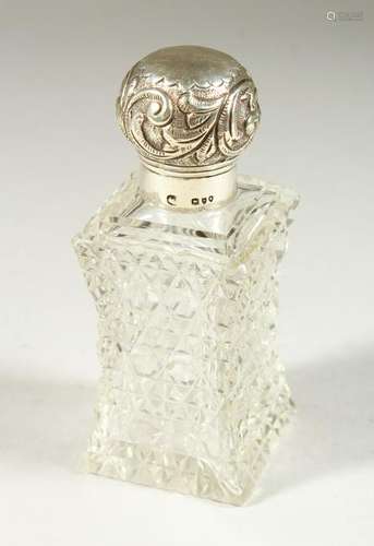 A VICTORIAN SHAPED CUT GLASS SCENT BOTTLE AND STOPPER