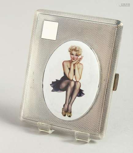 AN ENGINE TURNED CIGARETTE CASE, with an enamel oval of