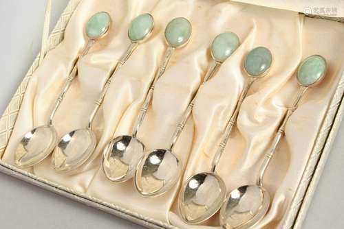 A SET OF SIX SILVER AND JADE TEASPOONS.