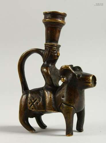 AN EASTERN SMALL BRONZE CANDLESTICK, modelled as a man