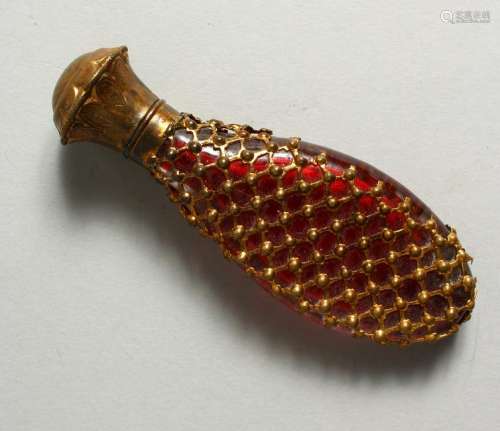 A GOOD RUBY AND GILT SCENT BOTTLE, with gold top and