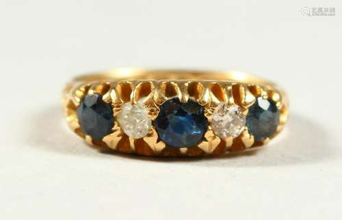 AN 18CT GOLD, SAPPHIRE AND DIAMOND FIVE STONE RING.