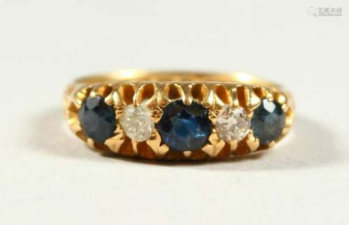 AN 18CT GOLD, SAPPHIRE AND DIAMOND FIVE STONE RING.