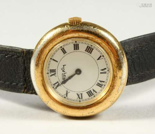 A ROY KING WRISTWATCH with a leather strap.