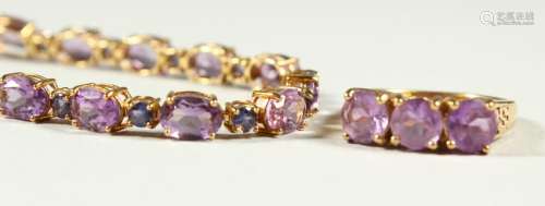 A 9CT GOLD AMETHYST BRACELET AND THREE STONE RING.