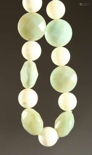 A JADE AND STONE NECKLACE.