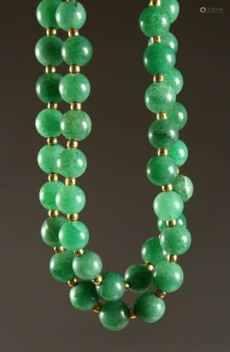 A LONG COLOURED JADE NECKLACE.  3ft 10ins long.