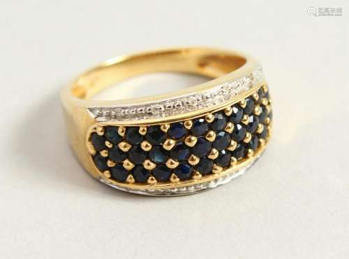 A 9CT GOLD, SAPPHIRE AND DIAMOND WIDE RING.