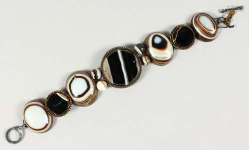 A BANDED AGATE BRACELET, comprising seven plaques and