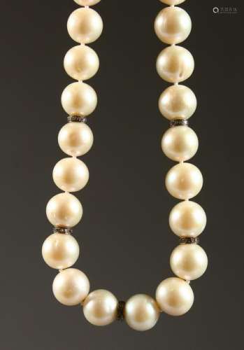 A PEARL NECKLACE, interspersed with small diamonds.
