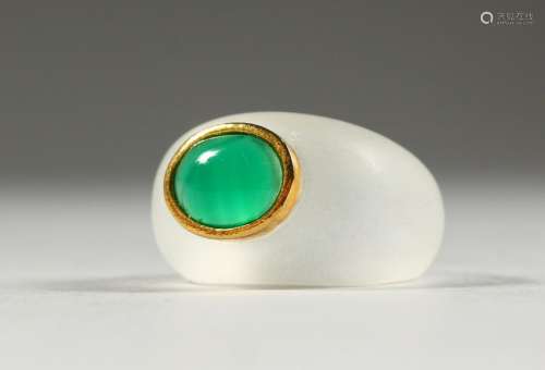 AN UNUSUAL CRYSTAL RING, inset with a green stone.