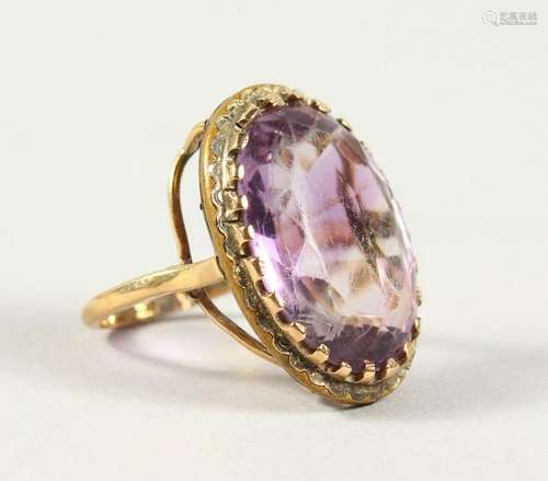 A 9CT GOLD AMETHYST RING.