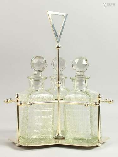 AN ART DECO STYLE THREE BOTTLE TANTALUS.  35cms high.