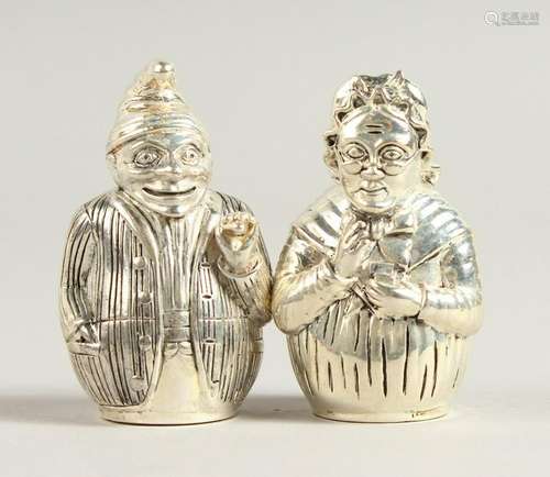 A PAIR OF .800 SILVER MR & MRS PUNCH SALT AND PEPPERS.