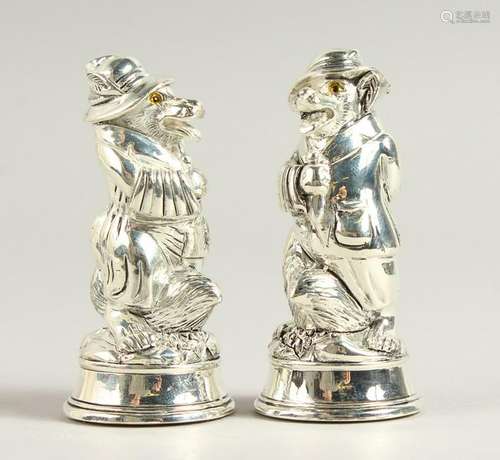 A PAIR OF .800 SILVER FOX IN A DRESS SALT AND PEPPERS.