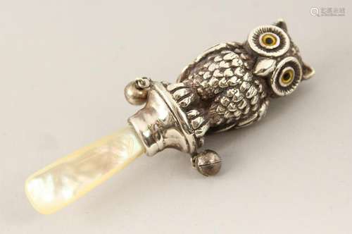 A SILVER AND MOTHER-OF-PEARL OWL BABIES RATTLE.