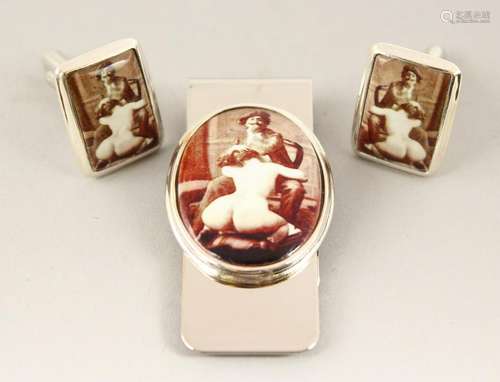 A SILVER AND ENAMEL NAUGHTY MONEY CLIP AND CUFFLINKS.