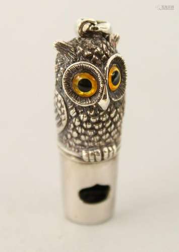 A SILVER OWL WHISTLE.