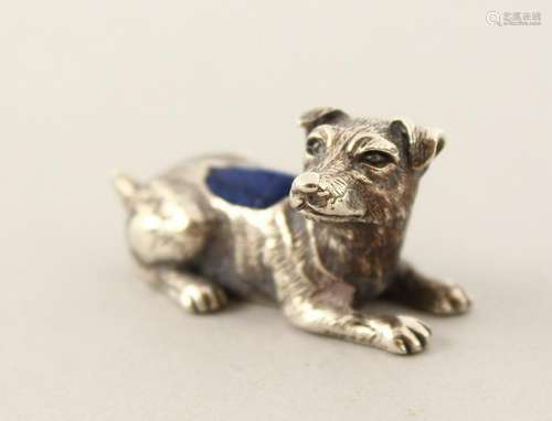 A SILVER DOG PIN CUSHION.