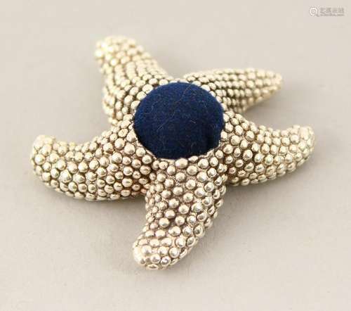 A SILVER STARFISH PIN CUSHION.