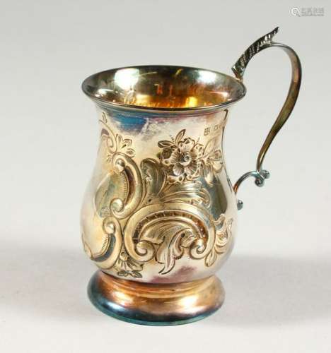 A CHRISTENING MUG, with floral repousse decoration.