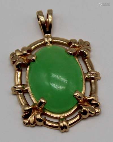 JEWELRY. 14kt Gold and Jade Cabochon Pendant.