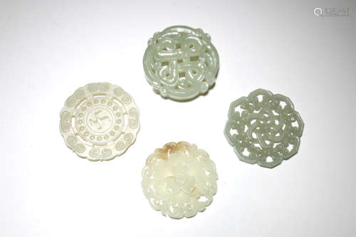 A Group of Four Chinese Carved Jade Pendant
