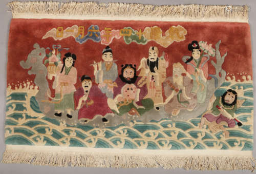 A 20th century Chinese wool rug decorated with seven immortals, 70cm x 138cm.