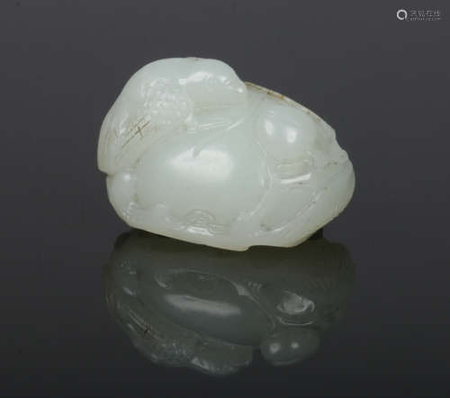 A Chinese carved pale celadon jade carving of a bird perched on a peach, 4cm wide.