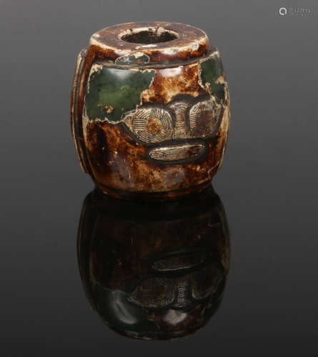 A Chinese altered jade carving of barrel form. With two panels decorated with archaistic motifs,