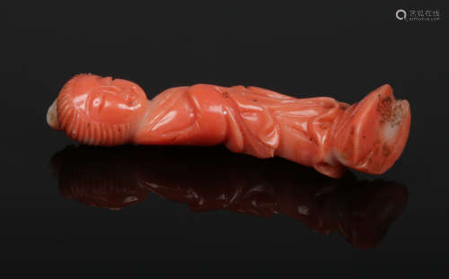 A Chinese miniature coral carving of Guanyin, 4cm.Condition report intended as a guide only.No chips