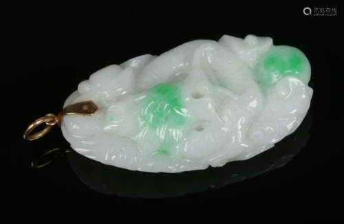 A Chinese white jade pendant with spinach green suffusion and 14 carat gold clasp. Finely carved