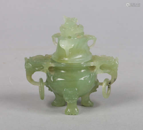 A Chinese 20th century miniature jade censer and cover. Carved with mythical beasts and separated