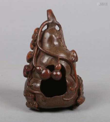 A 19th century Chinese carved bamboo brush washer. Formed as a gourd and with a fruit bat to the