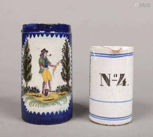 A 19th century Continental delft jug, blue ground and with serrated reserves painted in polychrome
