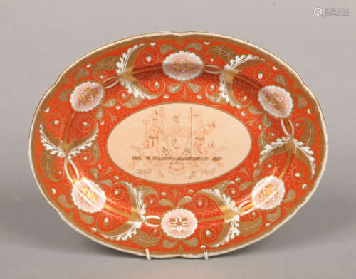 A Herculaneum lobed serving platter. Ground in burnt orange and with a wide border of gilt