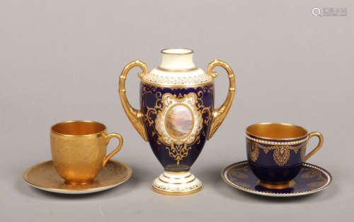 A Coalport twin handled vase along with a Coalport gilt cabinet cup and saucer and a Royal Worcester