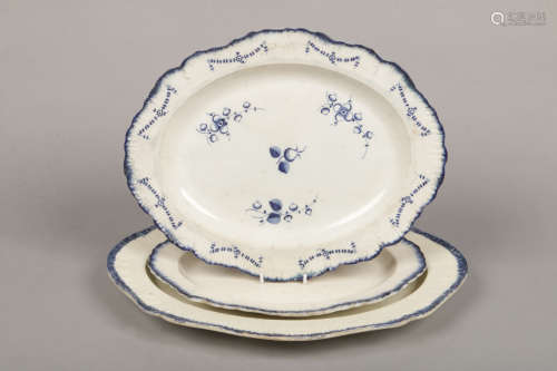 An 18th century pearlware serving platter, with feather moulded rim and painted in underglaze blue